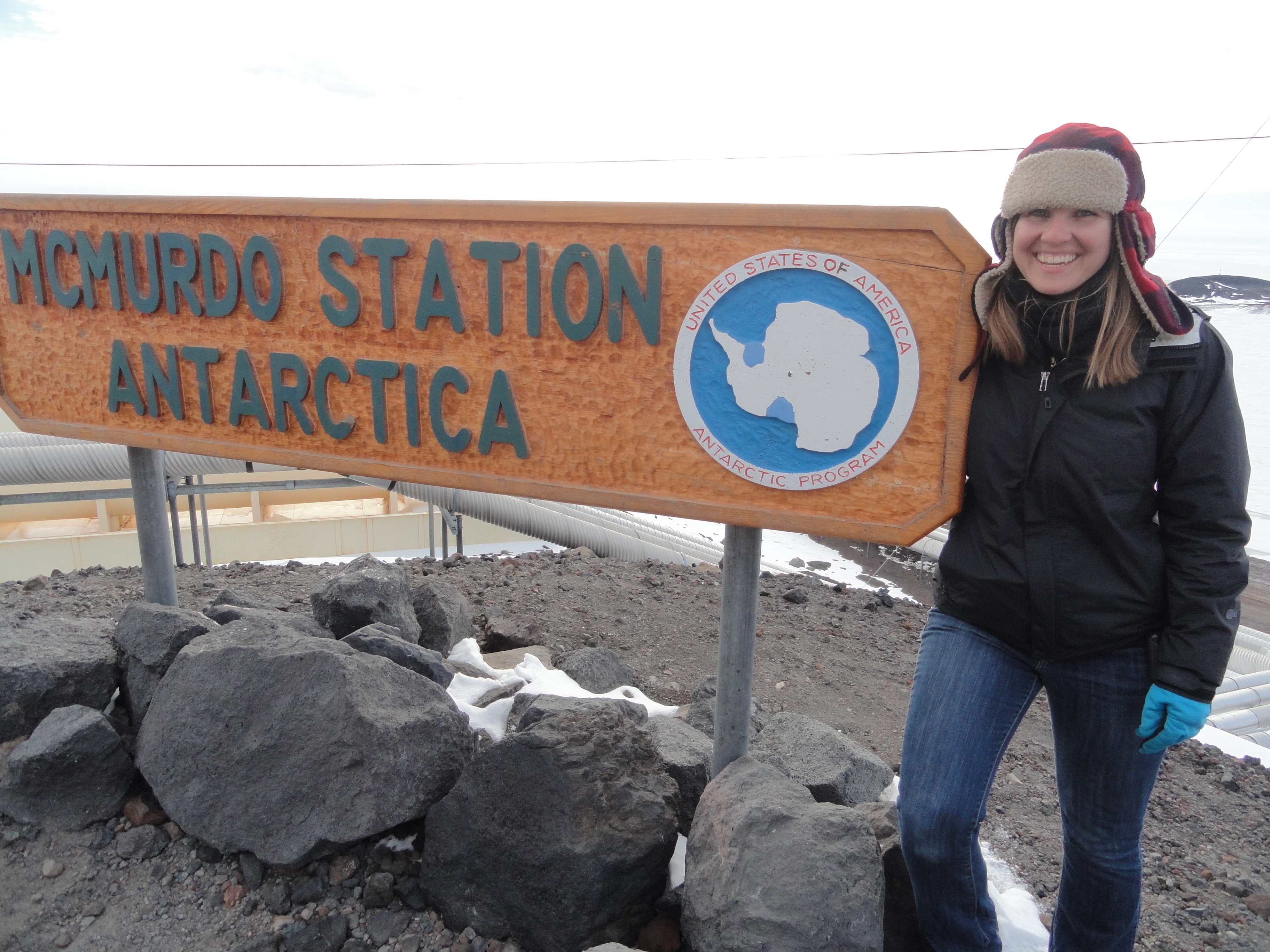 Gail Muldoon next to McMurdo Station in Antarctica
