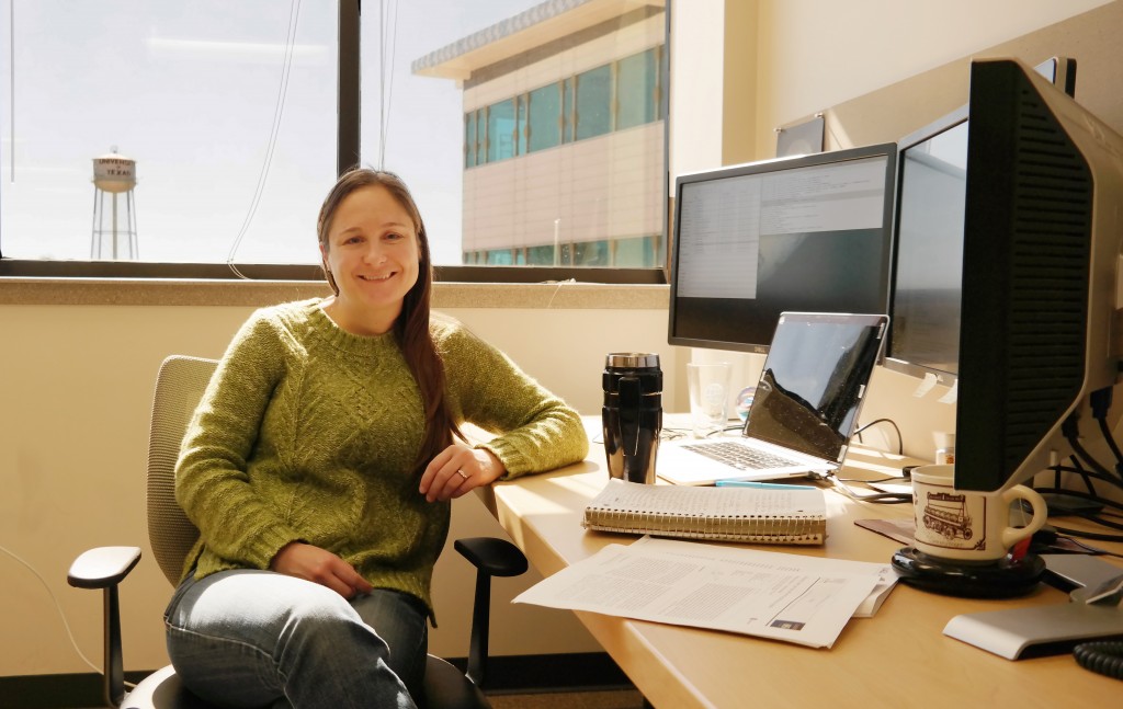 Krista Soderlund sits at her desk on the JJ Pickle Research Campus