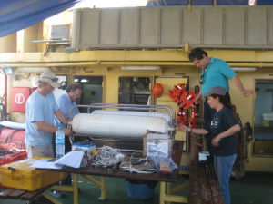 Members of the University of Texas Institute for Geophysics (UTIG) and National Autonomous University of Mexico (UNAM) prepare the boomer system for deployment off the R/V Justo Sierra on the Campeche Bank. (Photo courtesy John Goff)