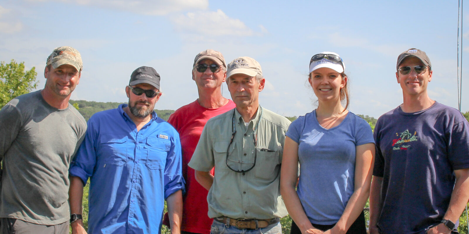 Jud Partin (right) with members of the paleoclimate research lab during core testing at the Jackson School's White Family Outdoor Learning Center in July 2019.