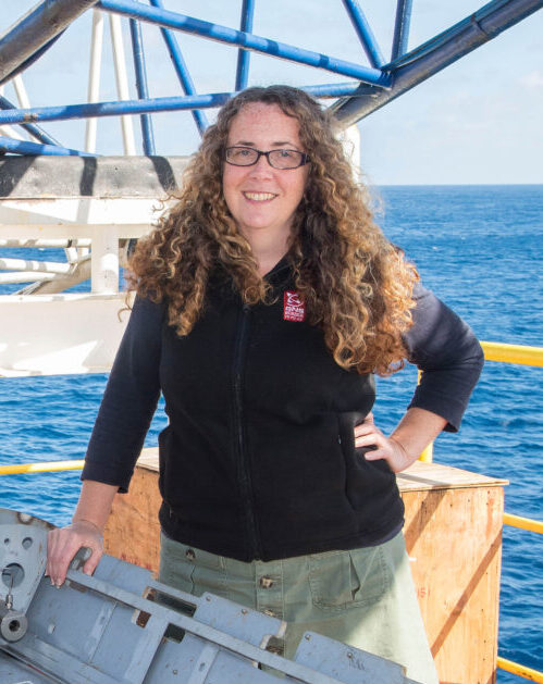 Picture of Laura facing the camera on a research vessel at sea