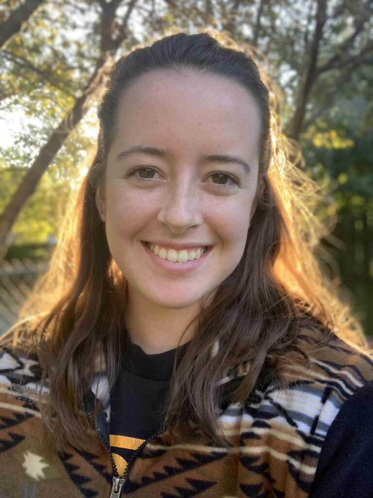 Headshot of Erin smiling at the camera