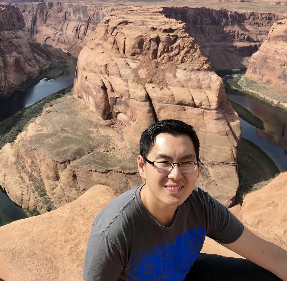 Picture of Dan Fu above a canyon.