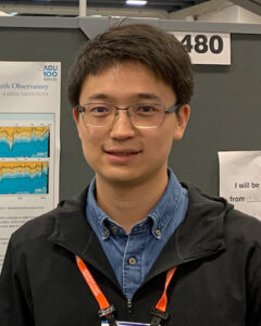 Portrait picture of Jinxuan in front of an AGU science poster