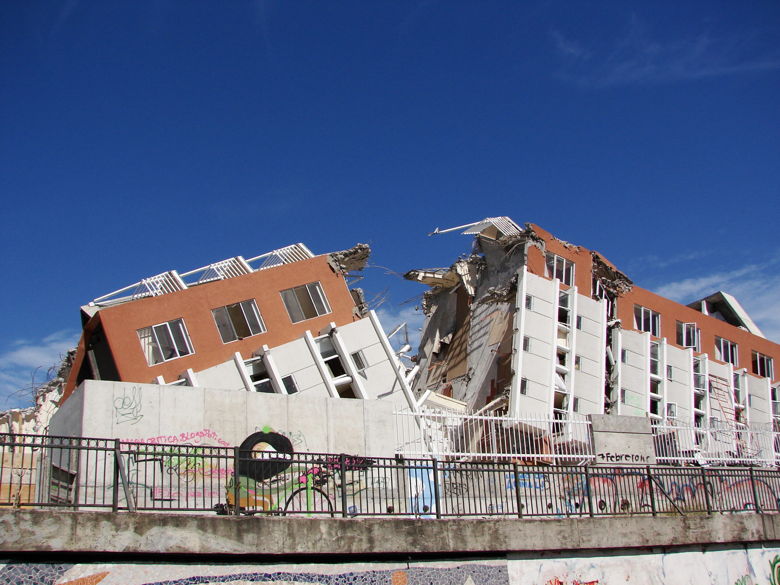 The four-storey apartment block is split in two with both sides showing major damage.
