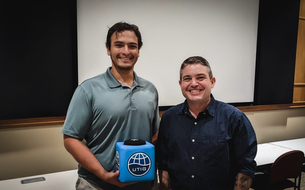 Photo of Charles holding the blue UTIG mic box with Eric.