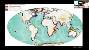 Screenshot from Nick's talk showing a figure of map of the world with tectonic markings and a video tile of Nick talking in the corner.