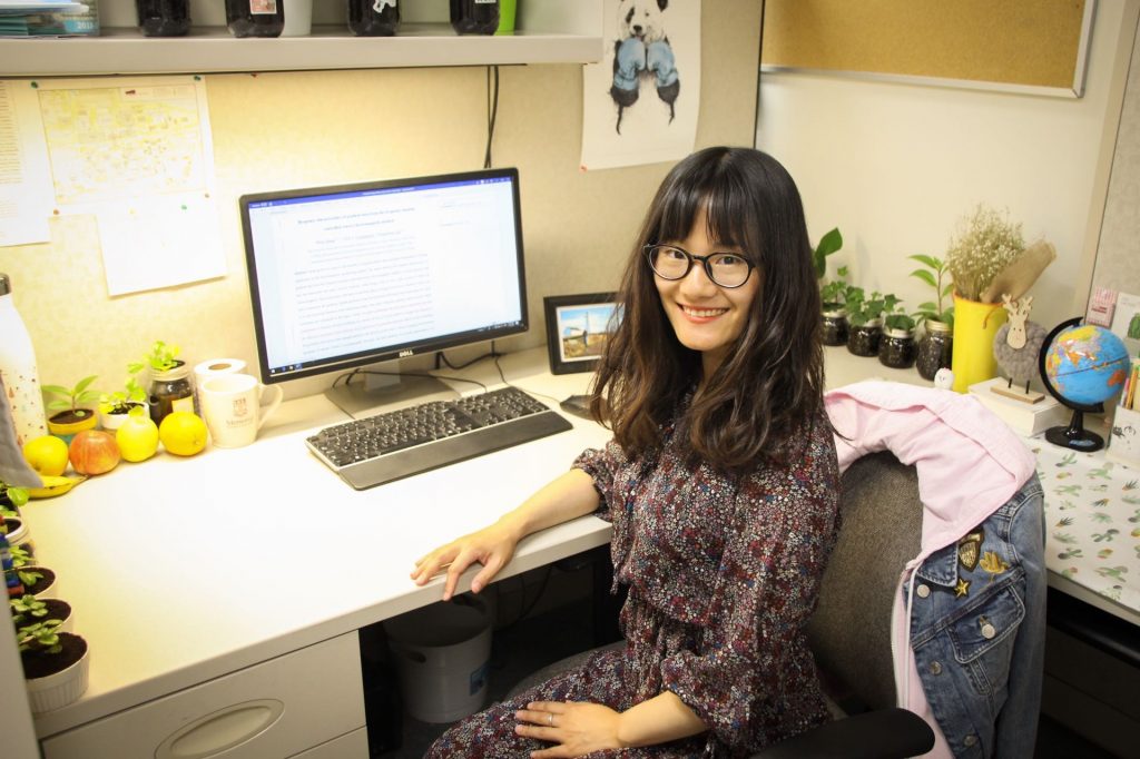 Photo of Ming at her desk