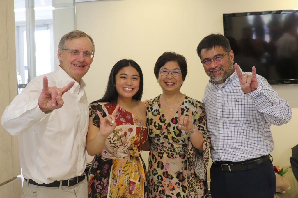 Senior researcher Peter Flemings, Abby Varona, and her family at Varona's graduation ceremony, pictured from left to right.