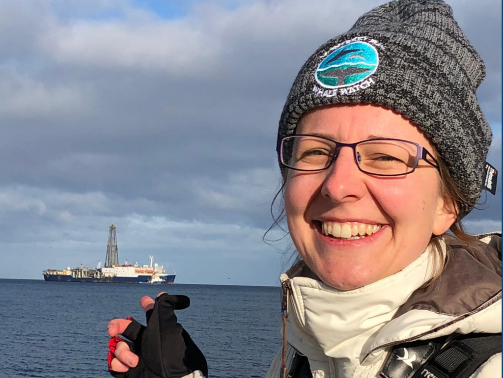 Portrait photo of Anieke in front of the Joides Resolution research vessel.