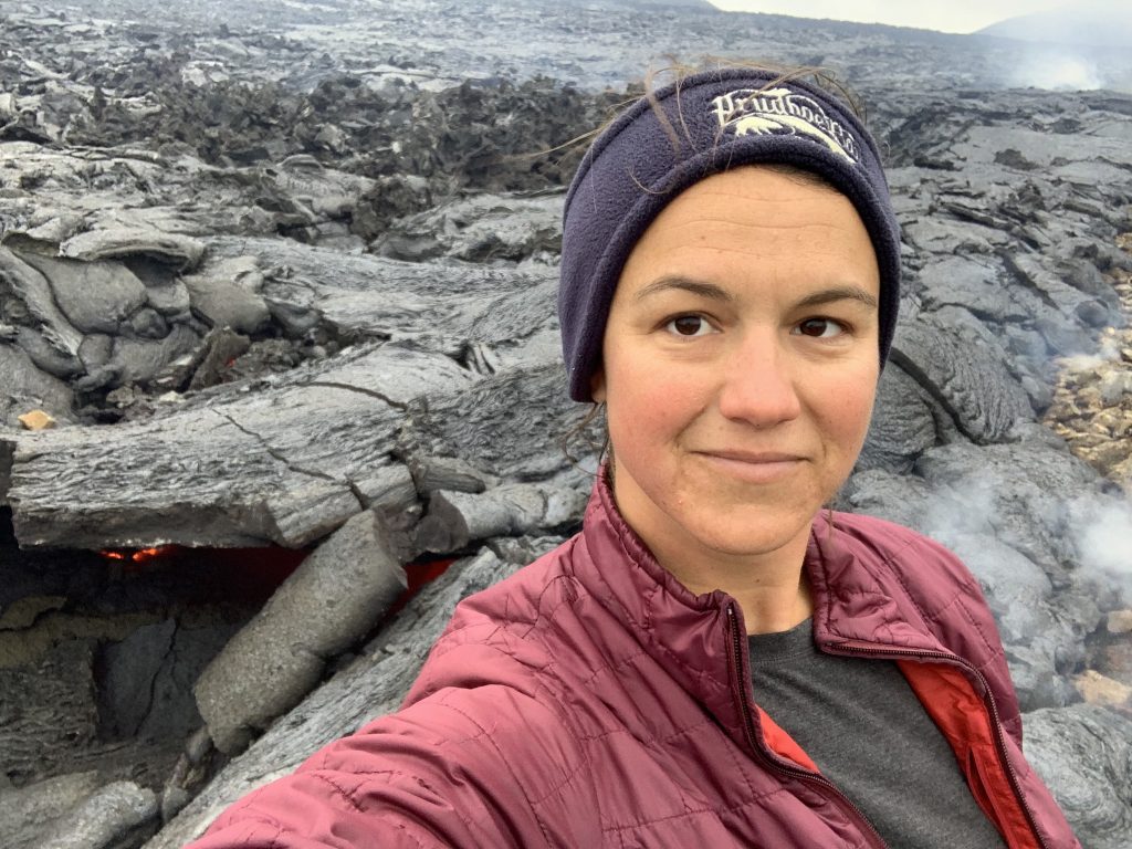 Selfie photo of Dallas in front of a volcanic landscape.