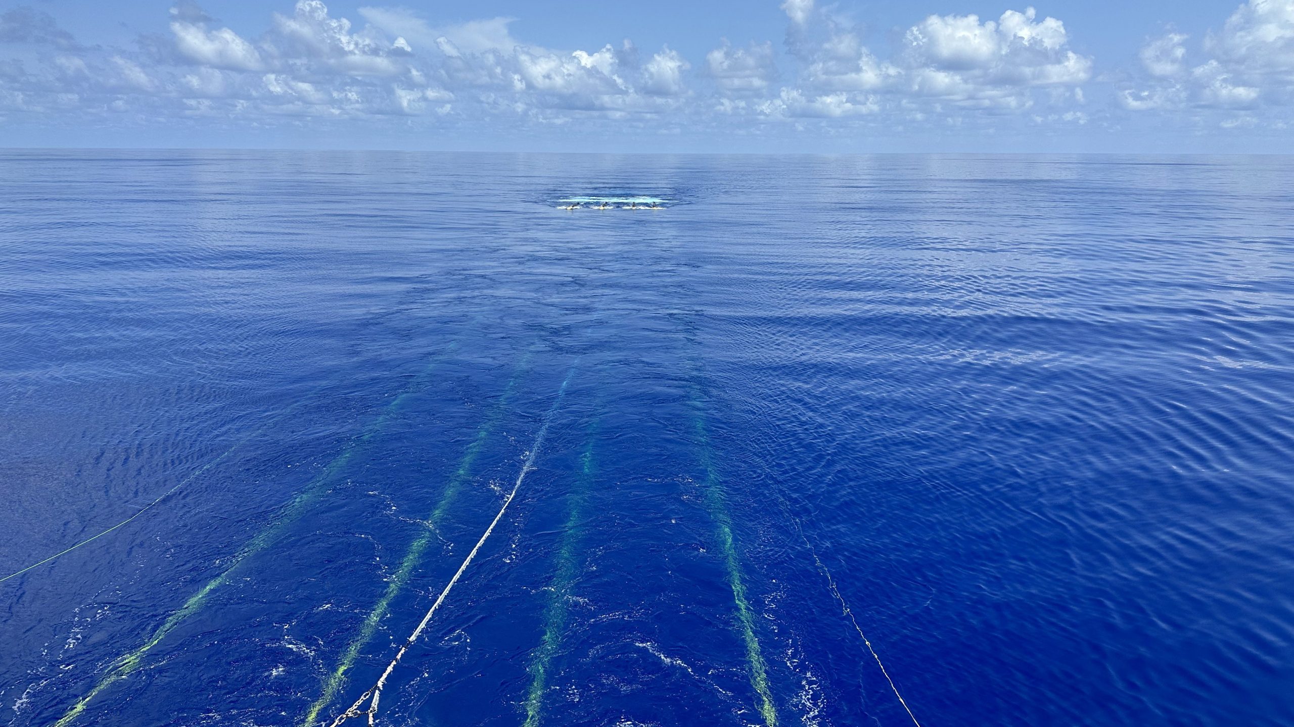 The streamer-airgun equipment trails in the ocean behind the RV Marcus Langseth. 