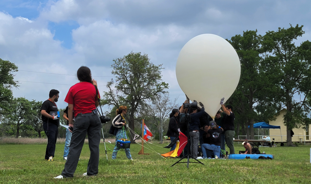 Puerto Rican balloon launch teams begin inflating their balloon during April's eclipse.