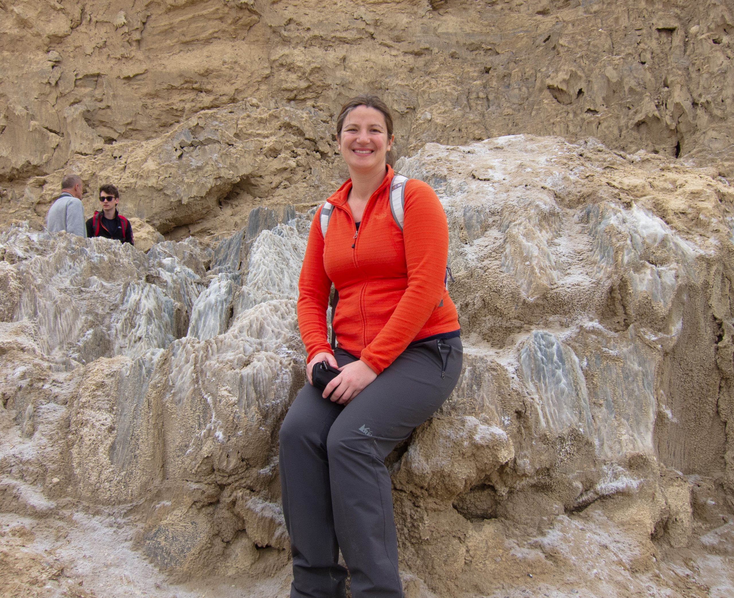 Picture of Maria sitting on a salt rock.