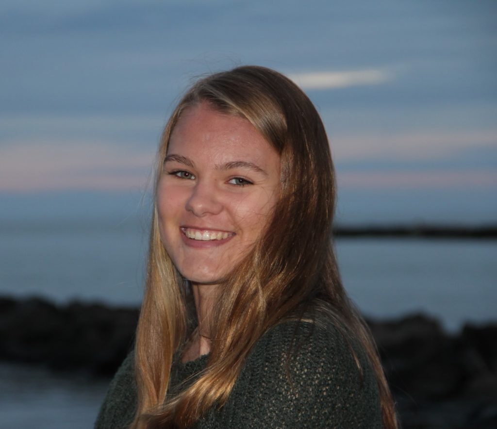 Photo of Emily in a beach.