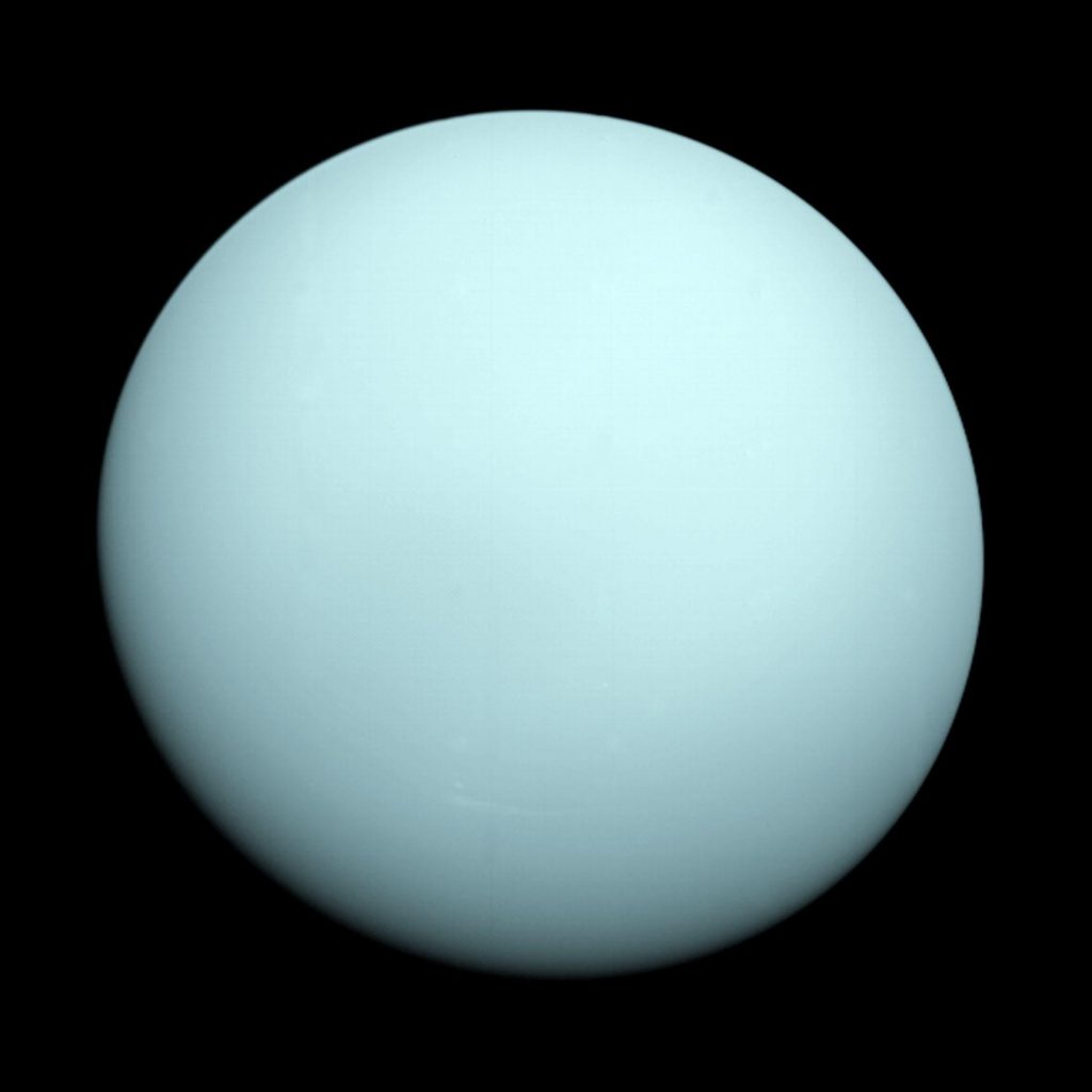 An image of Uranus. The planet appears featureless and is a milky blue.