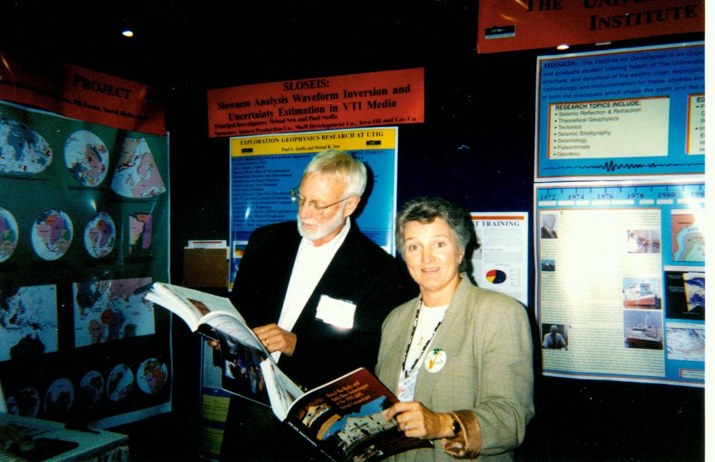 Old photo of two people at a conference