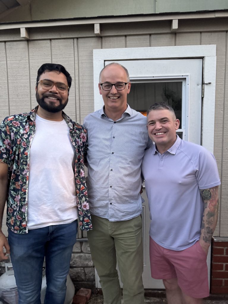 Photo of Shadab, Hesse and Hiatt in an informal backyard setting.