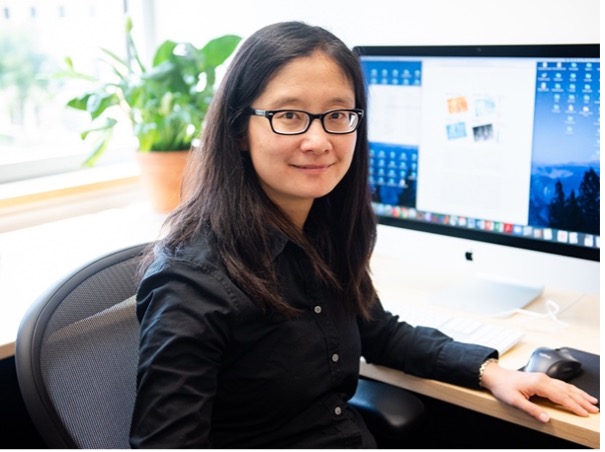 Ann Chen sitting at a computer
