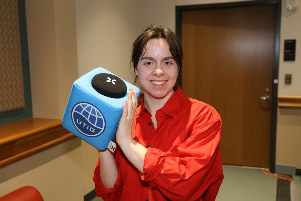 Dr. Sarah Steele holds the UTIG cube