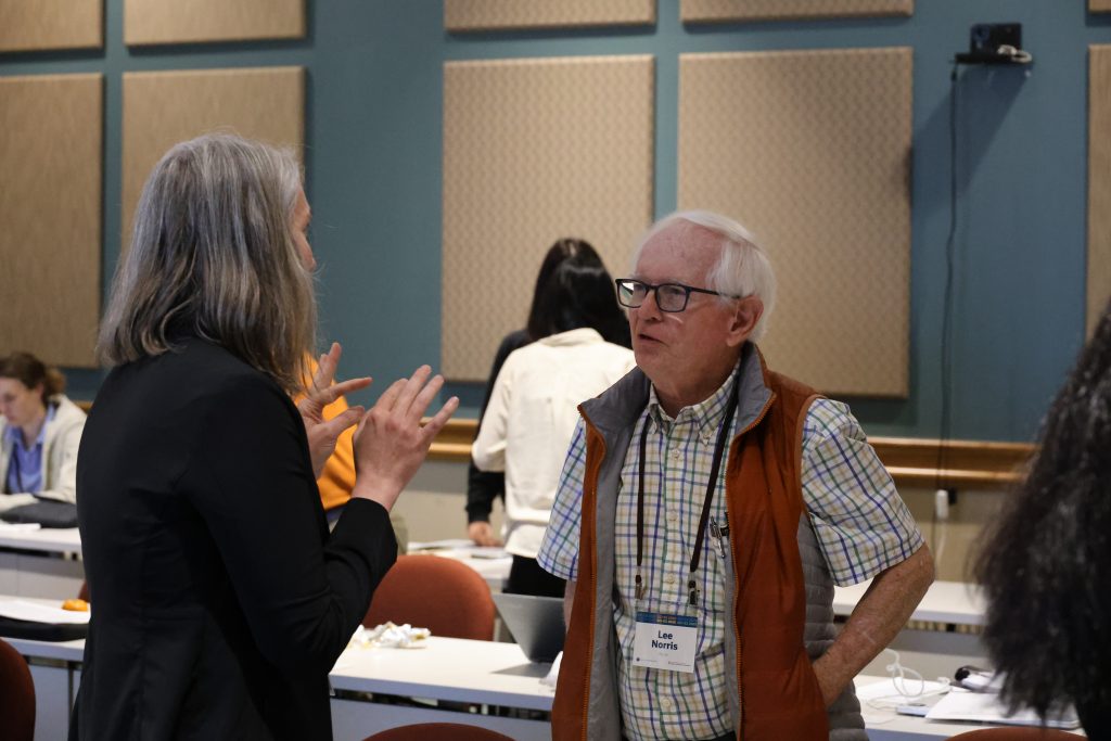 Dr. Lee Norris speaks with a workshop attendee