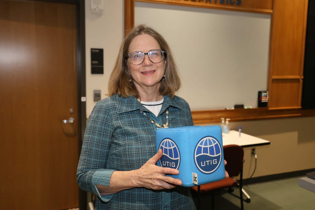 Francesca Samsel holding the UTIG cube